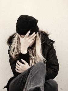 Depressed young homeless woman