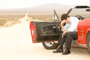 Car Man Head in Hands